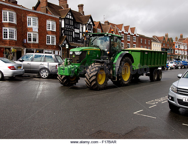 In the UK anyone with a driving license can drive a tractor