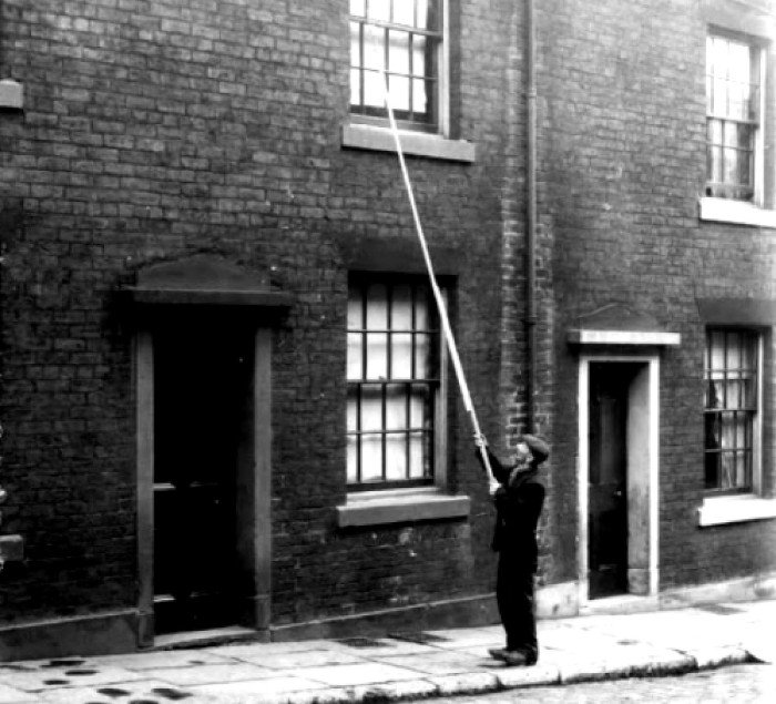 Before alarm clocks Knocker-Uppers stayed up all night and tapped on people’s windows to wake them up